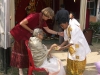 helping-the-puja-committe-member-to-serve-the-mother-in-law_resize